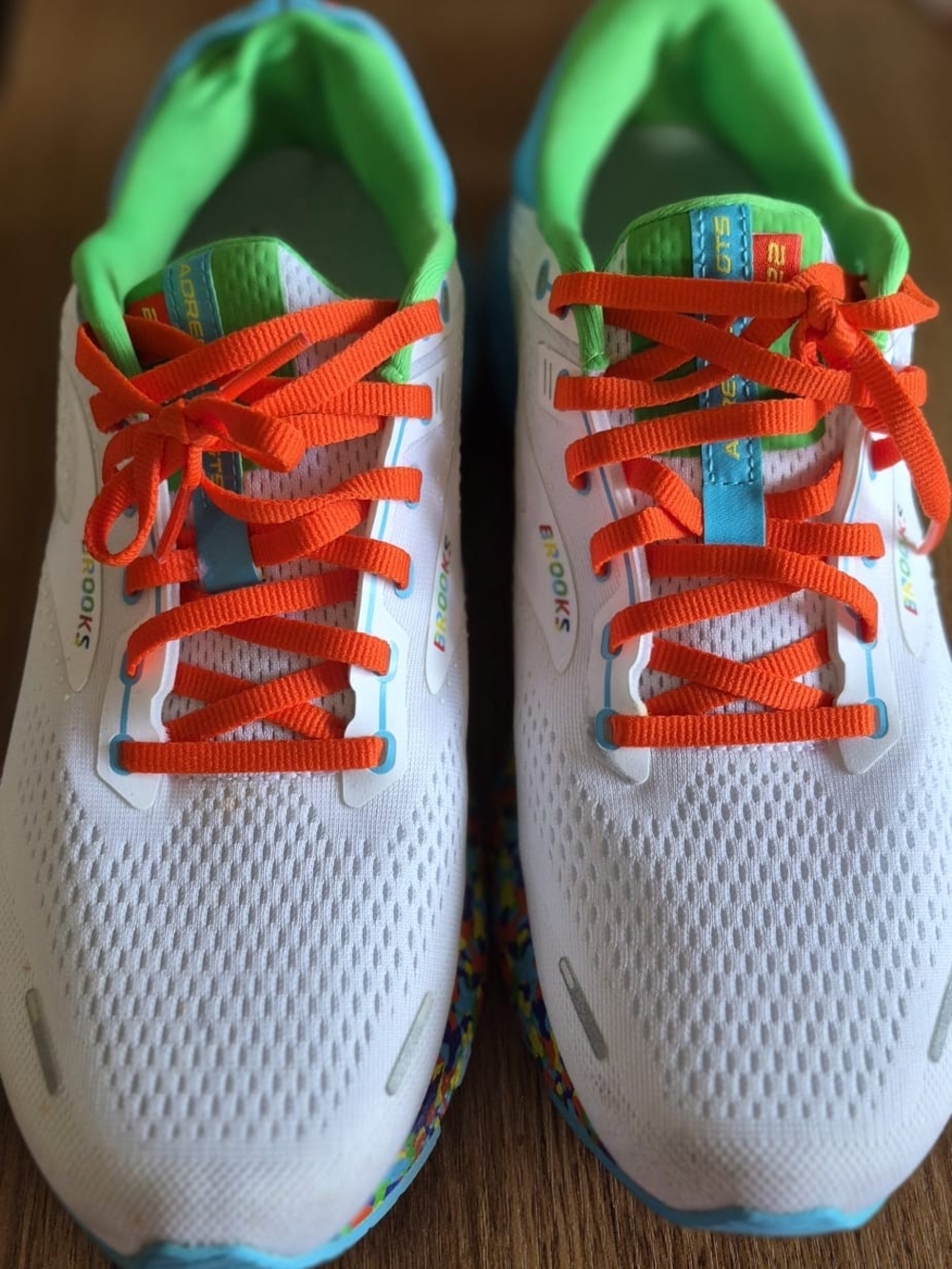 Brooks Kids White Sneakers with Orange Laces and Green Interior